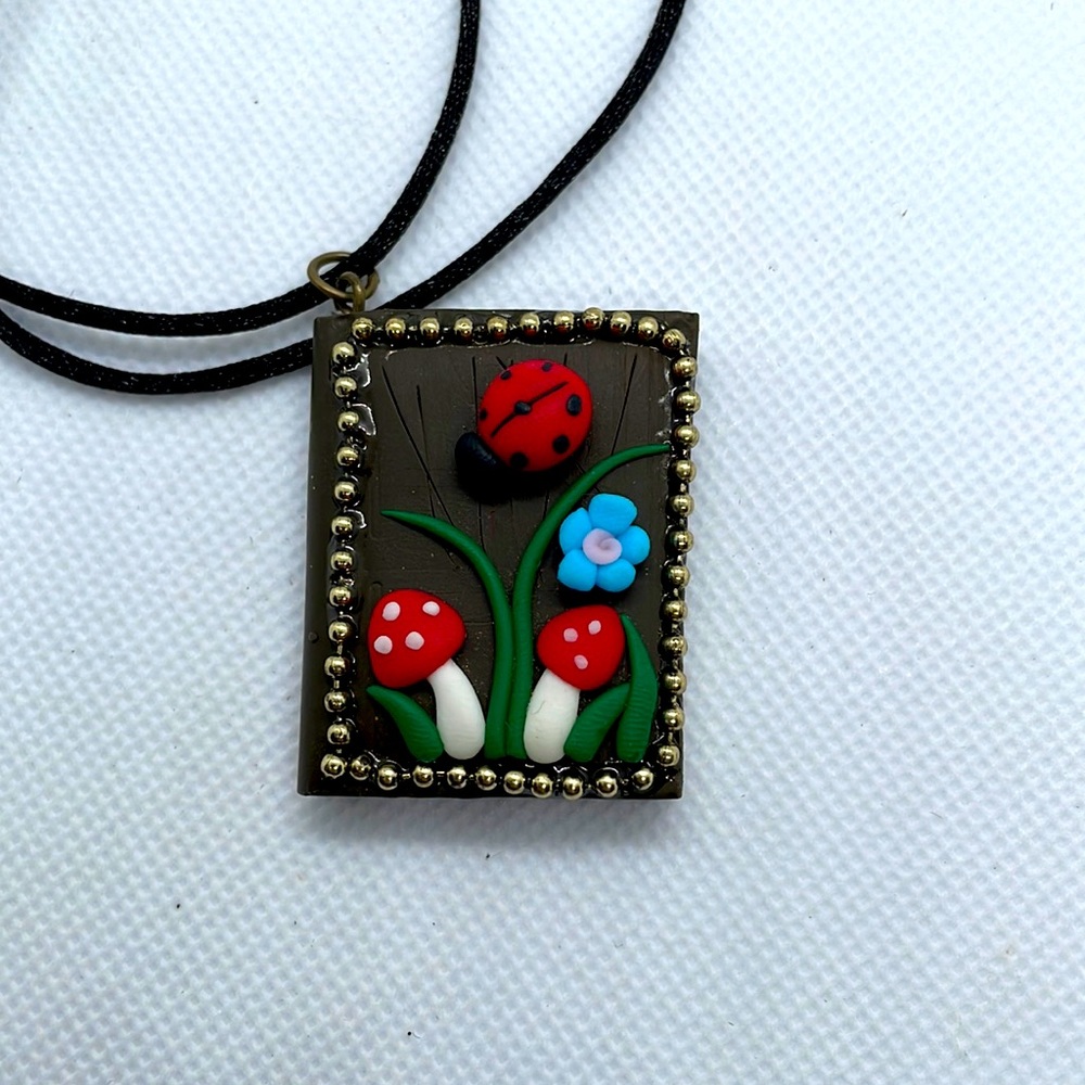 Cottagecore book clay pendant necklace with mushrooms